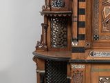 a large wooden cabinet with a clock on top of it