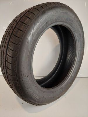 a close up of a tire on a white surface with a white background