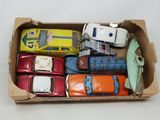 a cardboard box filled with assorted toy cars