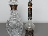 pair of antique cut glass decanters and a silver plated bottle