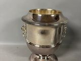 a silver plated bowl with handles and handles on a pedestal