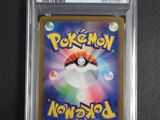 a close up of a pokemon card in a plastic case