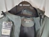 a jacket hanging on a hanger with a tag on it