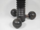 a black table with three wooden balls on top of it
