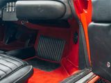 a close up of a car ' s interior with the door open
