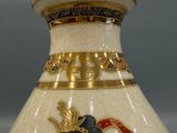 a vase with a picture of a woman on it