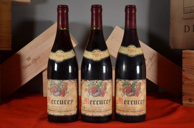 three bottles of red wine sitting on a table