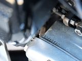 a close up of a motorcycle engine with a chain attached to it