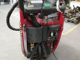 a machine that is sitting on the ground in the garage