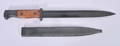 two knives that are laying side by side on a table