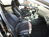 the interior of a car with black leather seats and black leather trims