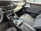 the interior of a car with a phone in the center of the dashboard