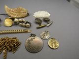 a lot of jewelry that is laying out on the table