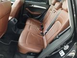 the back seats of a car are brown with black trims