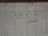 a sign on the wall of a building that says it ' s time to leave the house