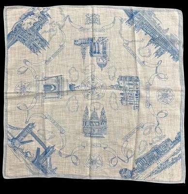 a close up of a blue and white handkerchief on a black background