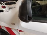 a white truck with a red stripe on the side of it