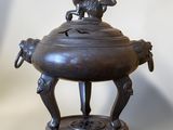 an image of a bronze incense burner with a dog on top of it