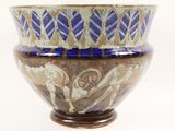 a blue and brown bowl sitting on top of a table