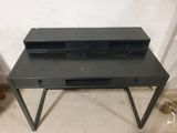 black metal desk with two drawers and a drawer on top