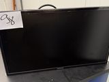 a black television sitting on top of a black table