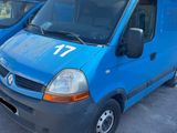 a blue van that is parked in a parking lot