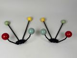 pair of multicolored beaded coat hooks on a white background