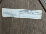 a picture of a close up of a label on a piece of wood
