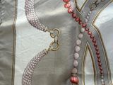 a picture of a necklace and a bracelet on a table
