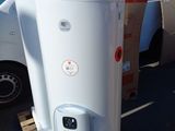 a white water heater sitting on a pallet in a parking lot
