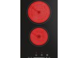 une plaque de cuisson noire et rouge équipée de deux feux