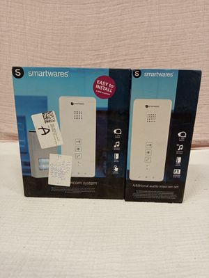 two nintendo wii remotes in the box on the table
