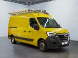 the yellow van is parked in a large room with a ladder on the roof