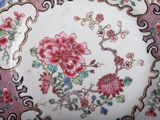 a plate with flowers on it on a table