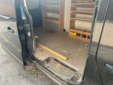 a van with the door open and shelves in the back of it