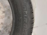 a close up of a car tire on a plastic bag