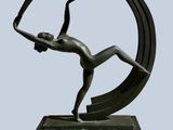 bronze sculpture of a woman in a circle holding a tennis racquet