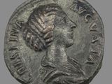 une pièce de monnaie ancienne sur laquelle figure la tête d'une femme coiffée d'une couronne