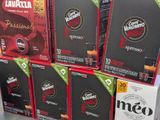 boxes of coffee are stacked on top of each other in a store