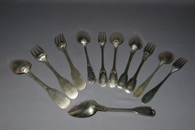 a lot of silver spoons and forks arranged in a circle