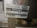 a label on the back of a machine in a kitchen