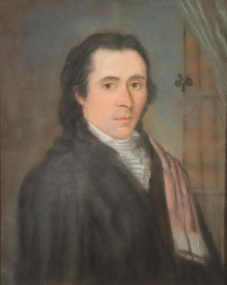 portrait d'un homme vêtu d'un manteau noir et d'une écharpe rose