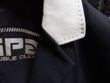 a black jacket with a white tie on it