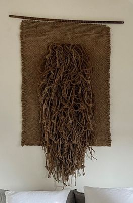 a picture of a wall hanging with a large piece of rope