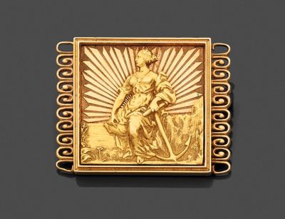 une image représentant une plaque plaquée or sur laquelle figure une femme tenant une épée
