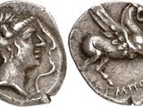 une pièce d'argent portant l'image d'une femme et d'un homme
