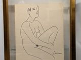 framed drawing of a man sitting on his knees in front of a white wall