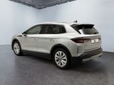 the rear end of a silver suv parked in a garage