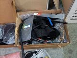 a box full of electronic equipment sitting on the floor