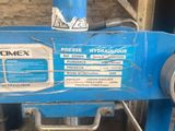 a blue machine that is sitting in a garage